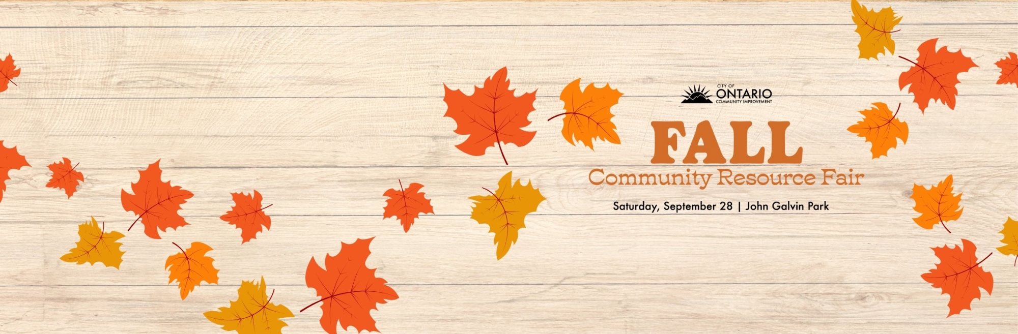 light wood background with various orange leaves text: "Fall Community Resource Fair John Galvin Park"